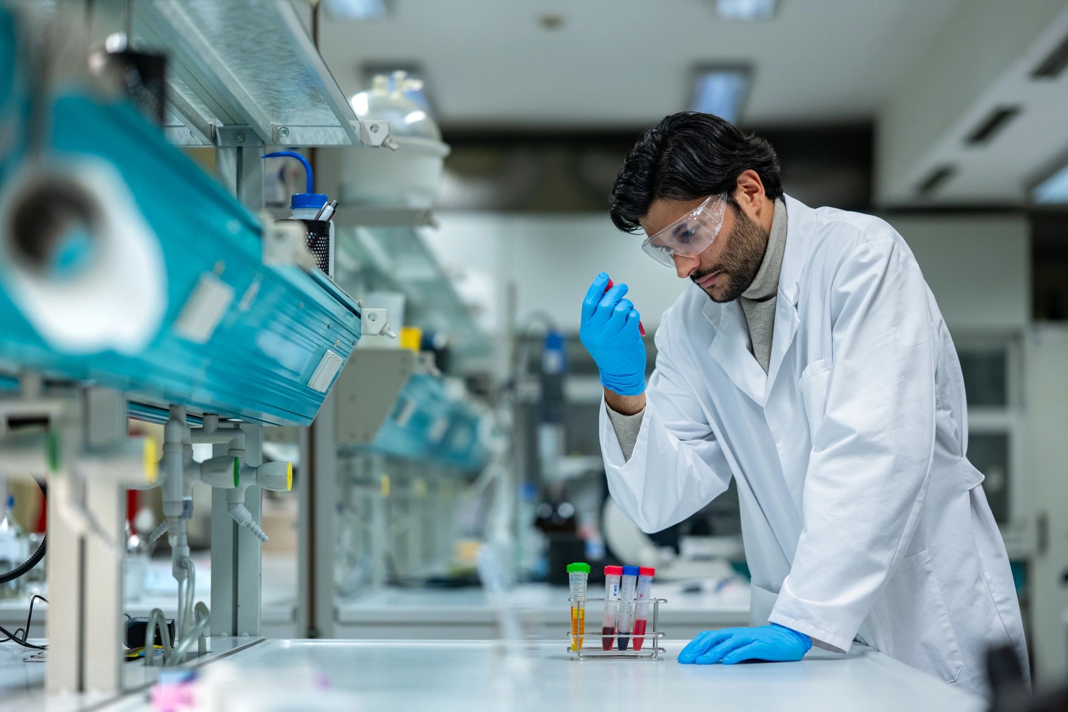 Scientist examining test tubes in an advanced health research lab