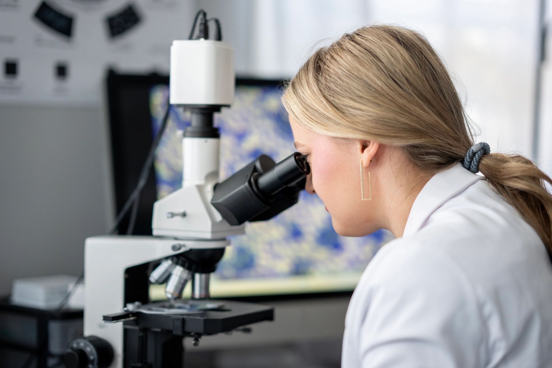 Scientist reviewing biomedical data in a modern laboratory